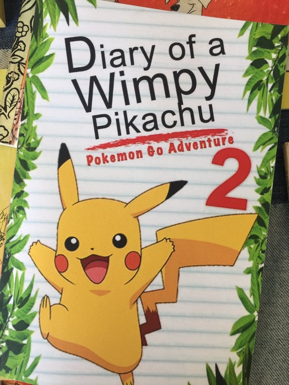 A book titled: Diary of a Whimpy Pikachu. 