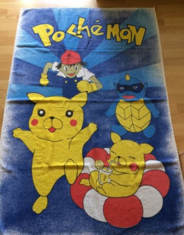 A towel that looks like it has pokemon cartoons on it however it is off brand and says Pocheman instead. 